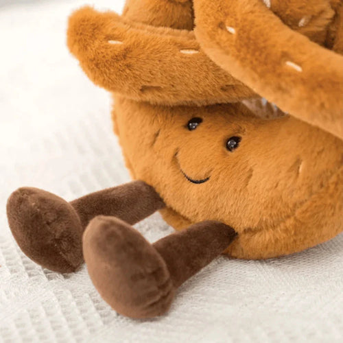Close-up view of baguette plush toy showing soft textured fabric and friendly embroidered facial expression