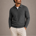 Men's quarter-zip knit jumper in charcoal grey with polo collar and ribbed cuffs, worn with cream chinos