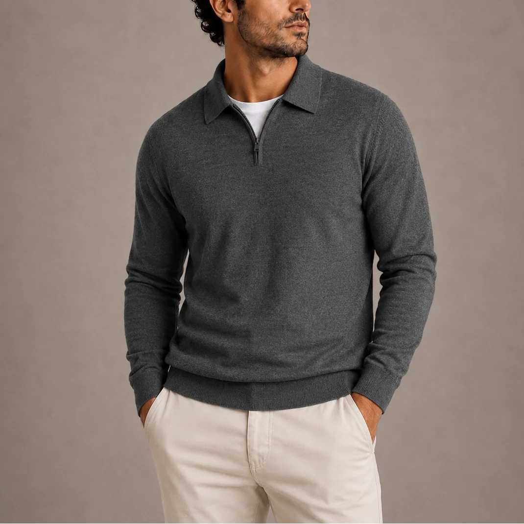 Men's quarter-zip knit jumper in charcoal grey with polo collar and ribbed cuffs, worn with cream chinos