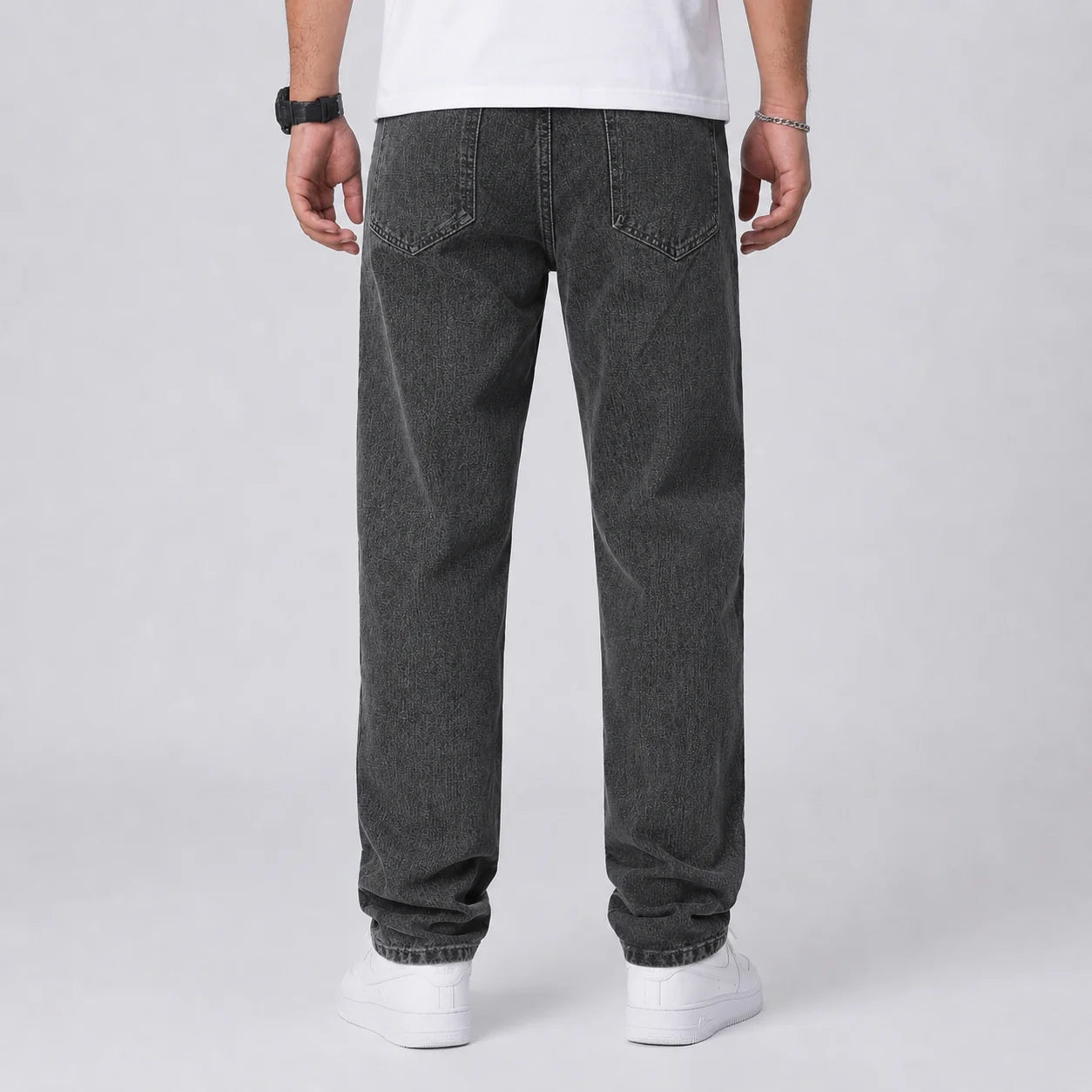 Full length view of men's relaxed fit wide leg jeans in light blue denim