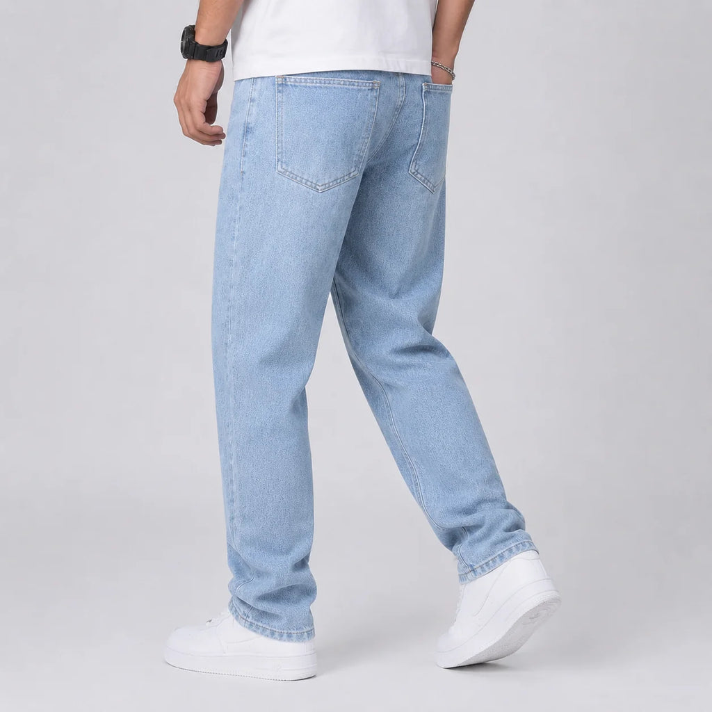 Side view of men's wide leg jeans showing loose straight silhouette and light blue wash