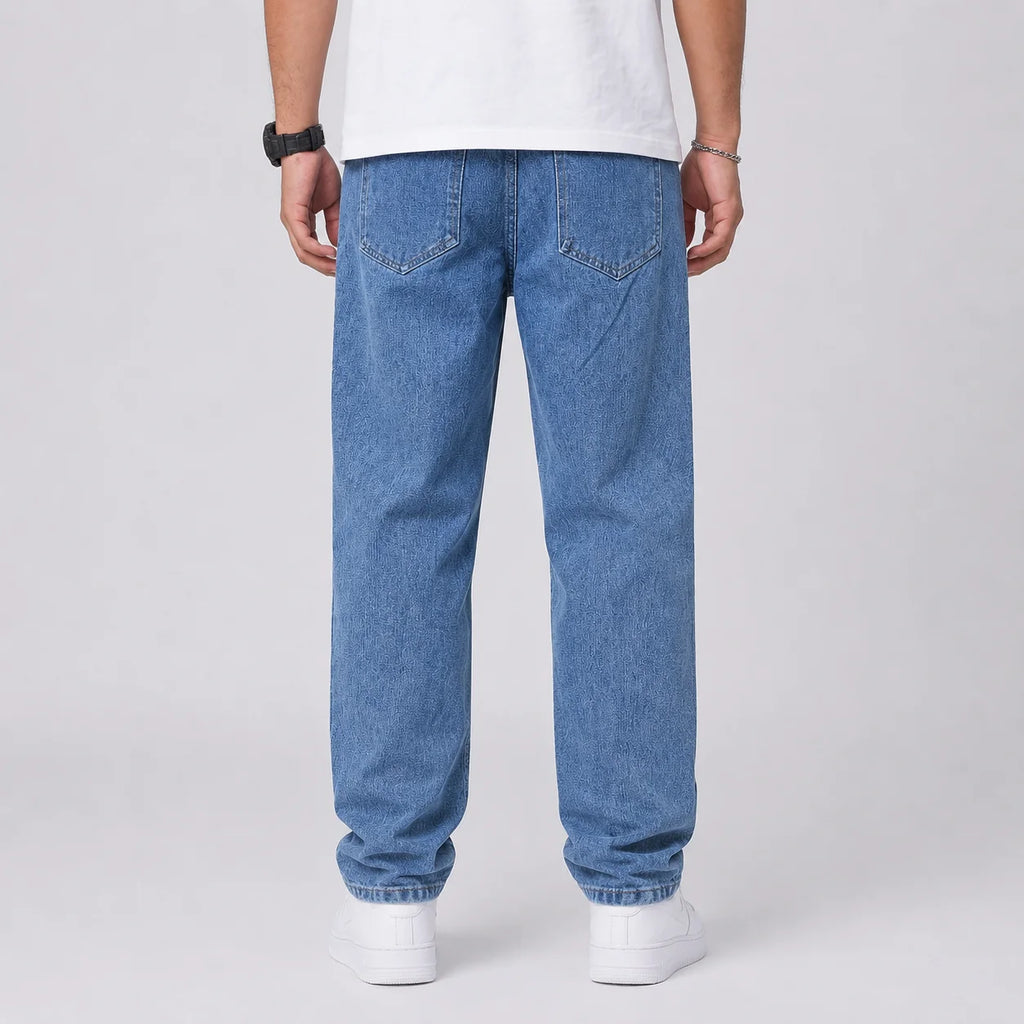 Back view of men's wide leg jeans showing relaxed fit and light blue denim wash