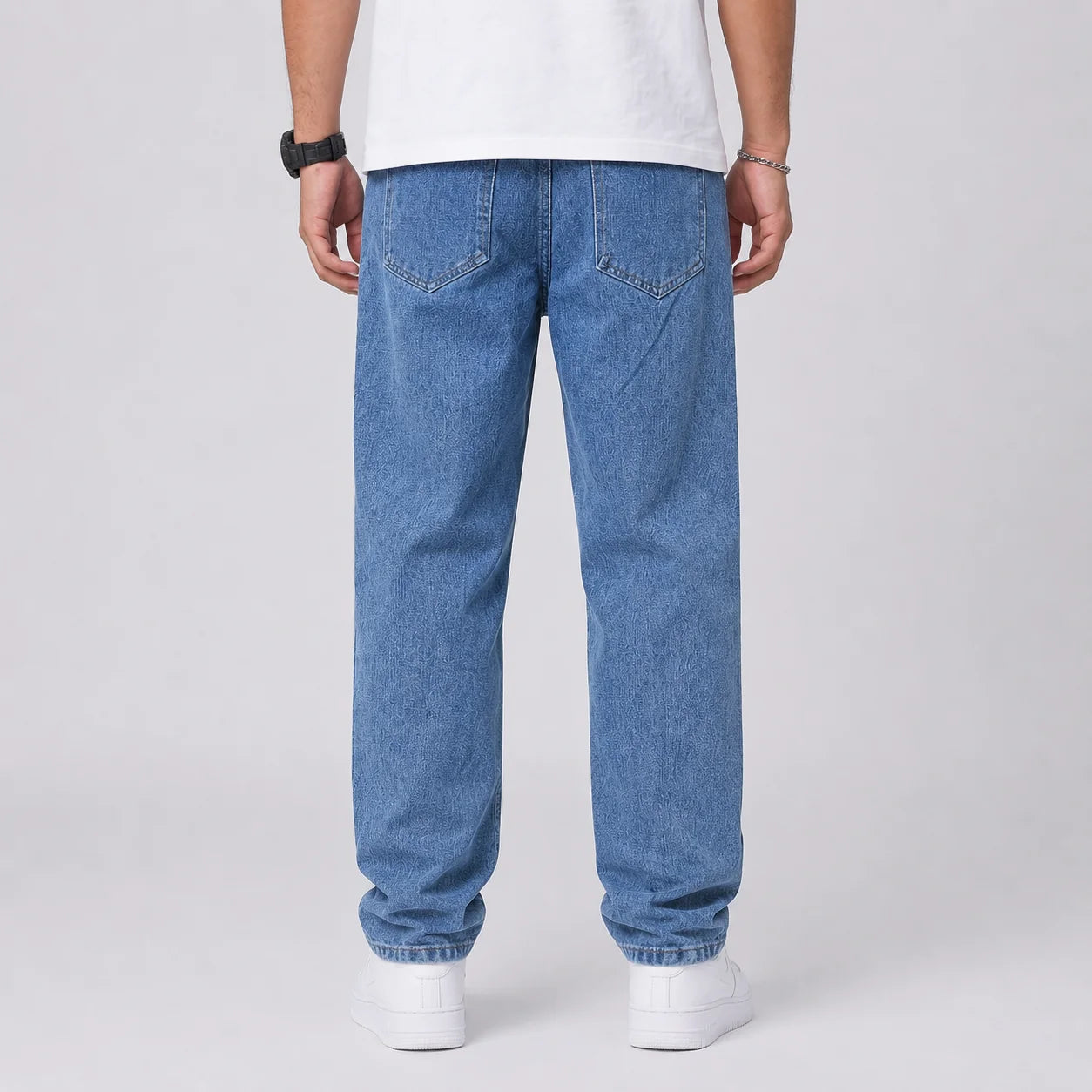 Back view of men's wide leg jeans showing relaxed fit and light blue denim wash