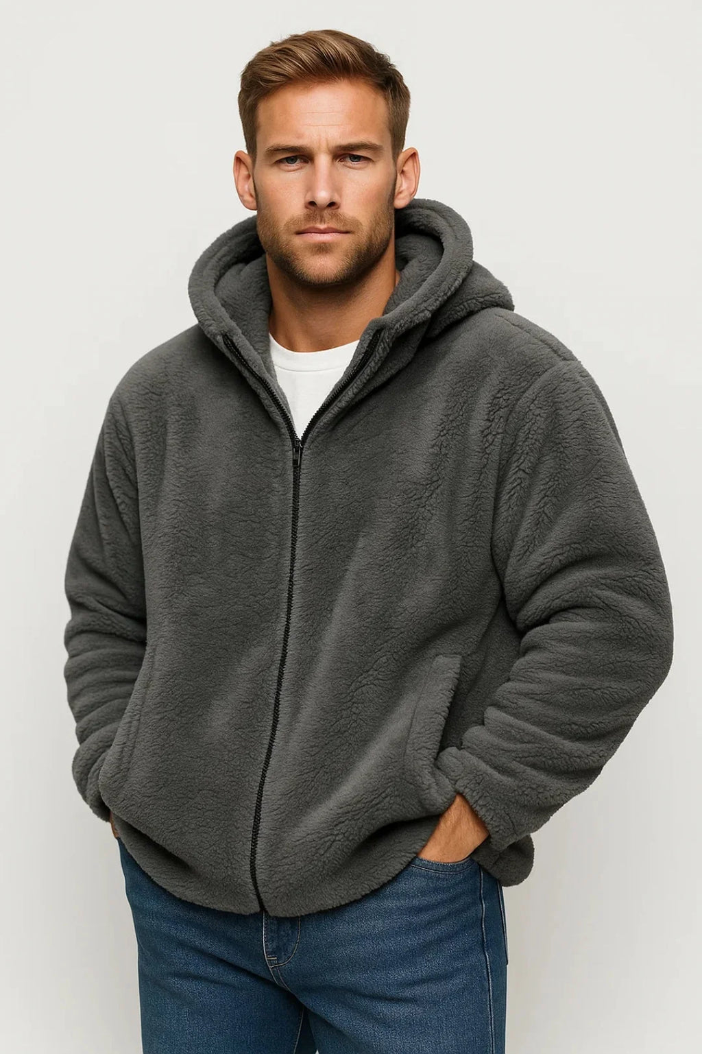 Men's fleece zip-up hoodie in dark grey with relaxed fit and adjustable hood worn over white T-shirt
