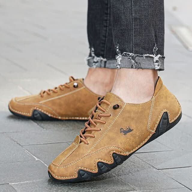 Men's lace-up casual trainers in tan with wavy textured outsole and contrast stitching detail