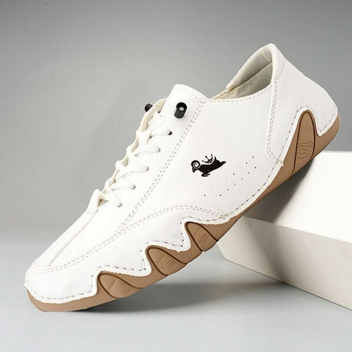 Side view of men's casual trainers showing flexible construction and distinctive wavy sole design