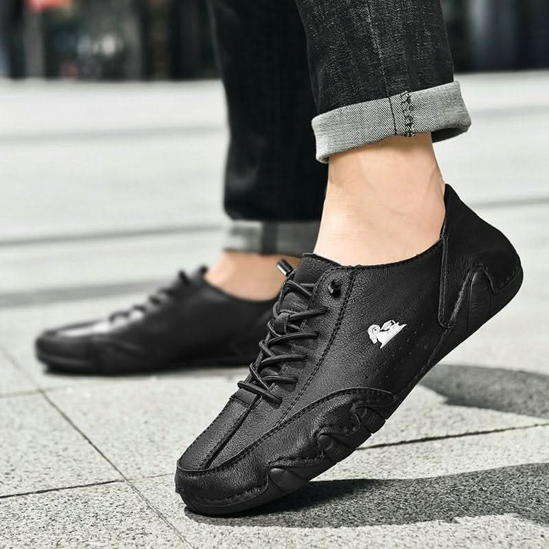 Tan men's casual trainers with distinctive wavy outsole pattern and secure lace-up system