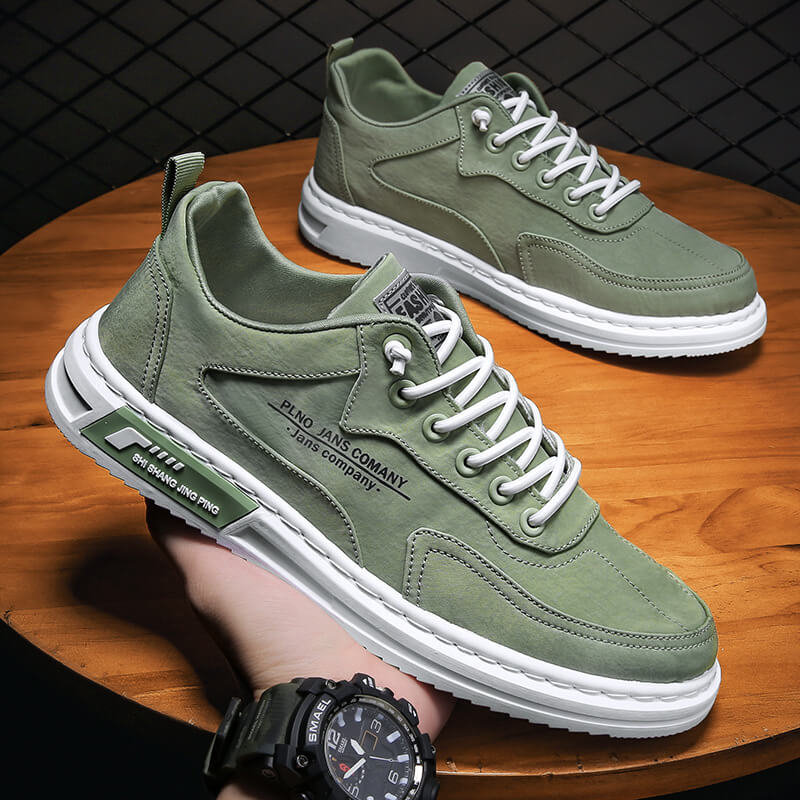 Pair of men's low-top trainers featuring layered white sole and tonal stitching accents