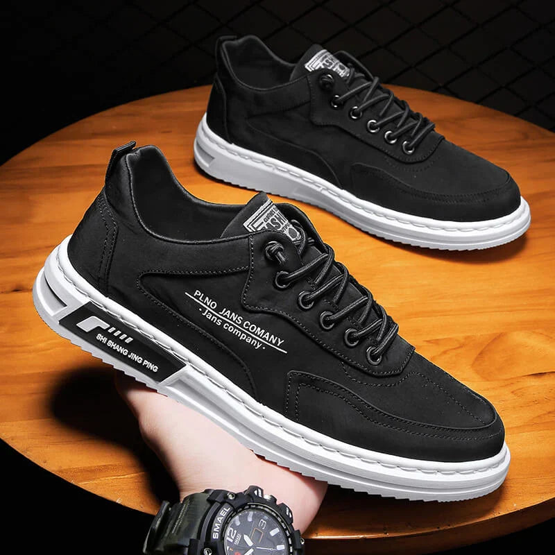Side view of men's casual trainers with secure lace-up closure and contrasting sole