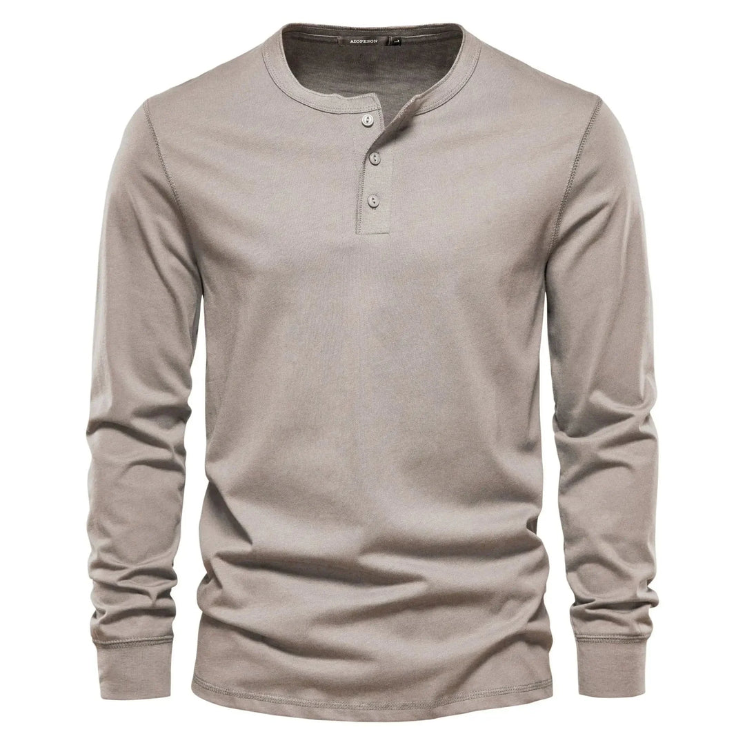 Close-up view of men's henley showing three-button neckline and ribbed collar detail