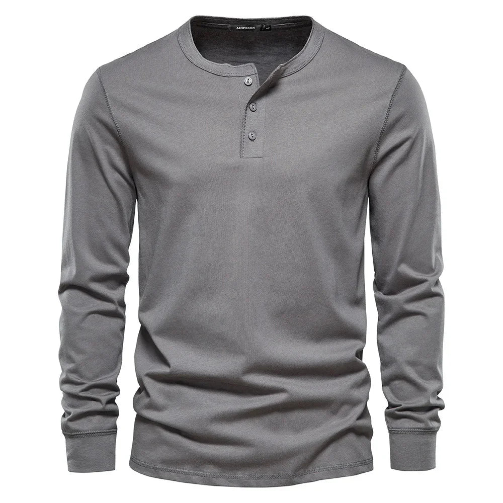 Men's henley top shown flat highlighting button placket and ribbed cuffs