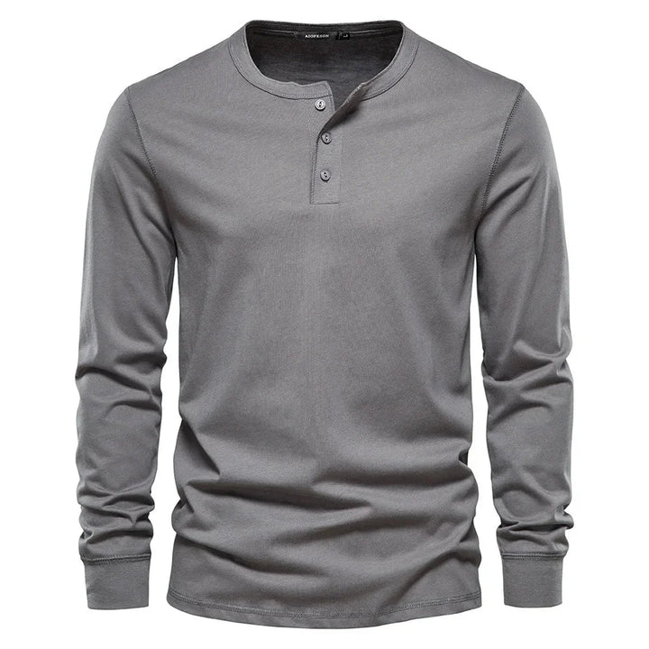 Men's henley top shown flat highlighting button placket and ribbed cuffs