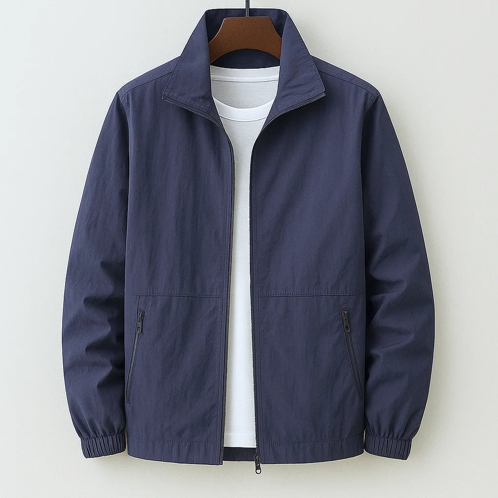 Men's navy zip-up casual jacket with stand collar and elasticated cuffs on hanger