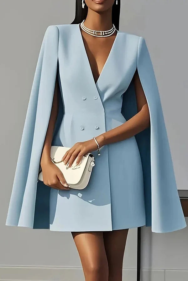 Powder blue cape mini dress with V-neckline and double-breasted front, styled with statement choker necklace
