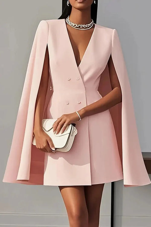 Side view of cape mini dress showing full-length cape sleeves and tailored bodice structure
