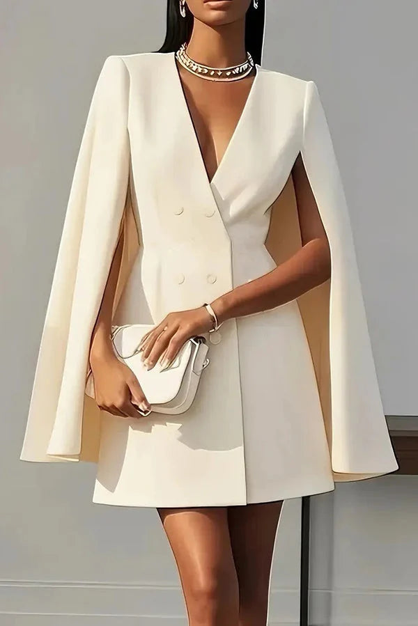 Close-up of double-breasted button detail and V-neckline on structured mini dress