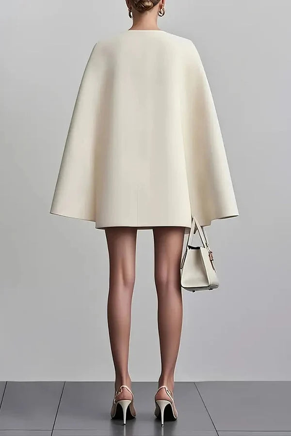 Full-length view of cape mini dress showing A-line skirt and dramatic cape silhouette