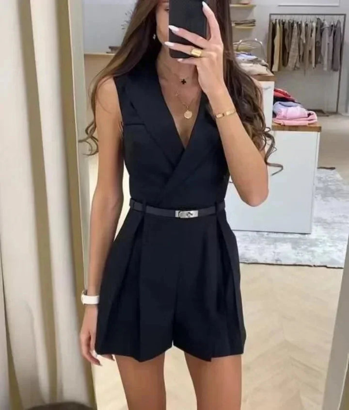 Sleeveless belted playsuit with deep V-neckline and tailored shorts in structured woven fabric