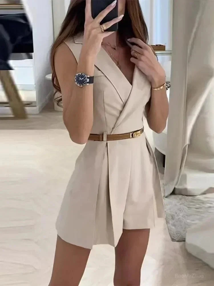 Close-up view of sleeveless belted playsuit showing wrap bodice and detachable belt detail