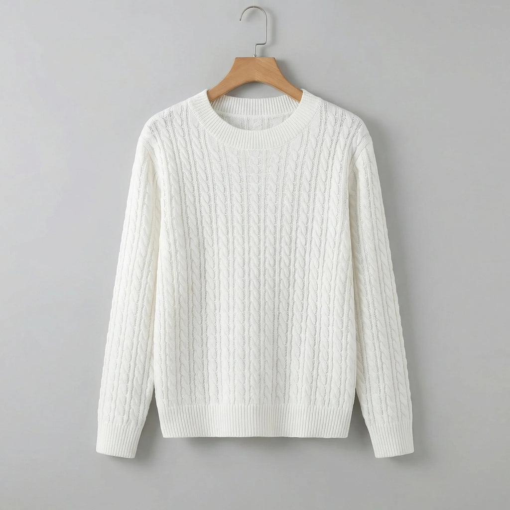 White cable knit jumper with crew neck and relaxed fit hanging on wooden hanger