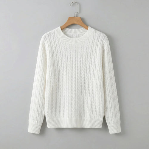 White cable knit jumper with crew neck and relaxed fit hanging on wooden hanger