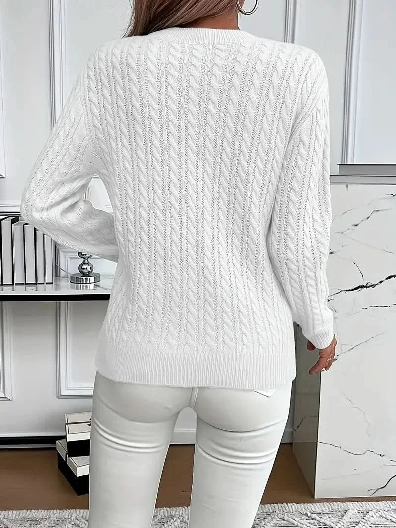 Full view of cable knit jumper showing timeless silhouette and textured knit