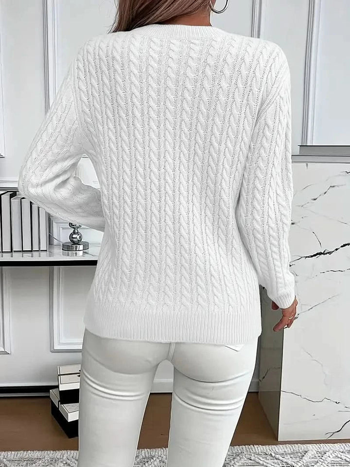 Full view of cable knit jumper showing timeless silhouette and textured knit