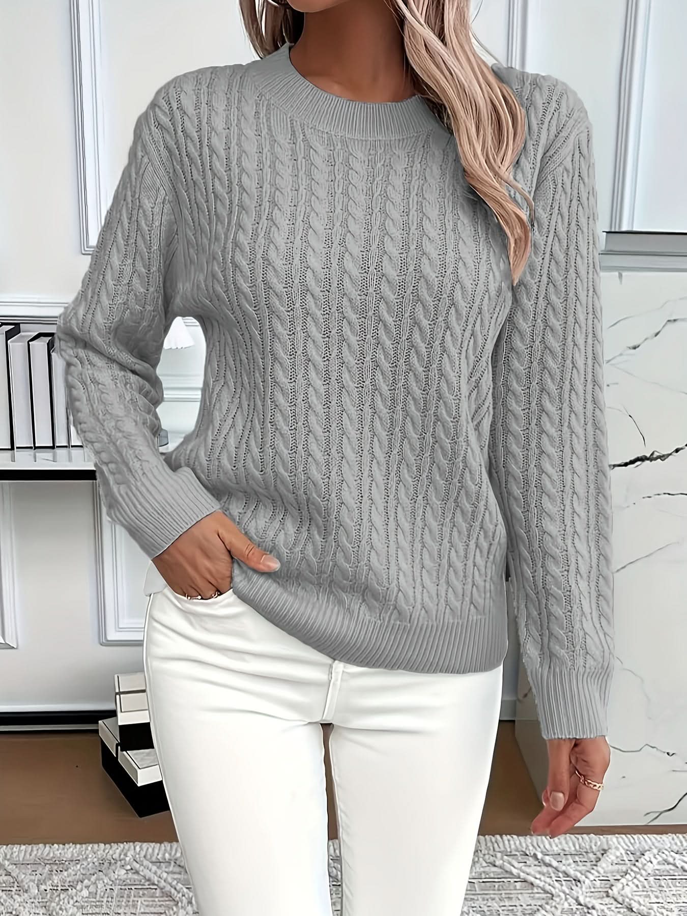 Back view of white cable knit jumper with textured pattern throughout