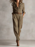 Women's checked tailored jumpsuit with notched lapel, belted waist, and tapered trousers in neutral tones