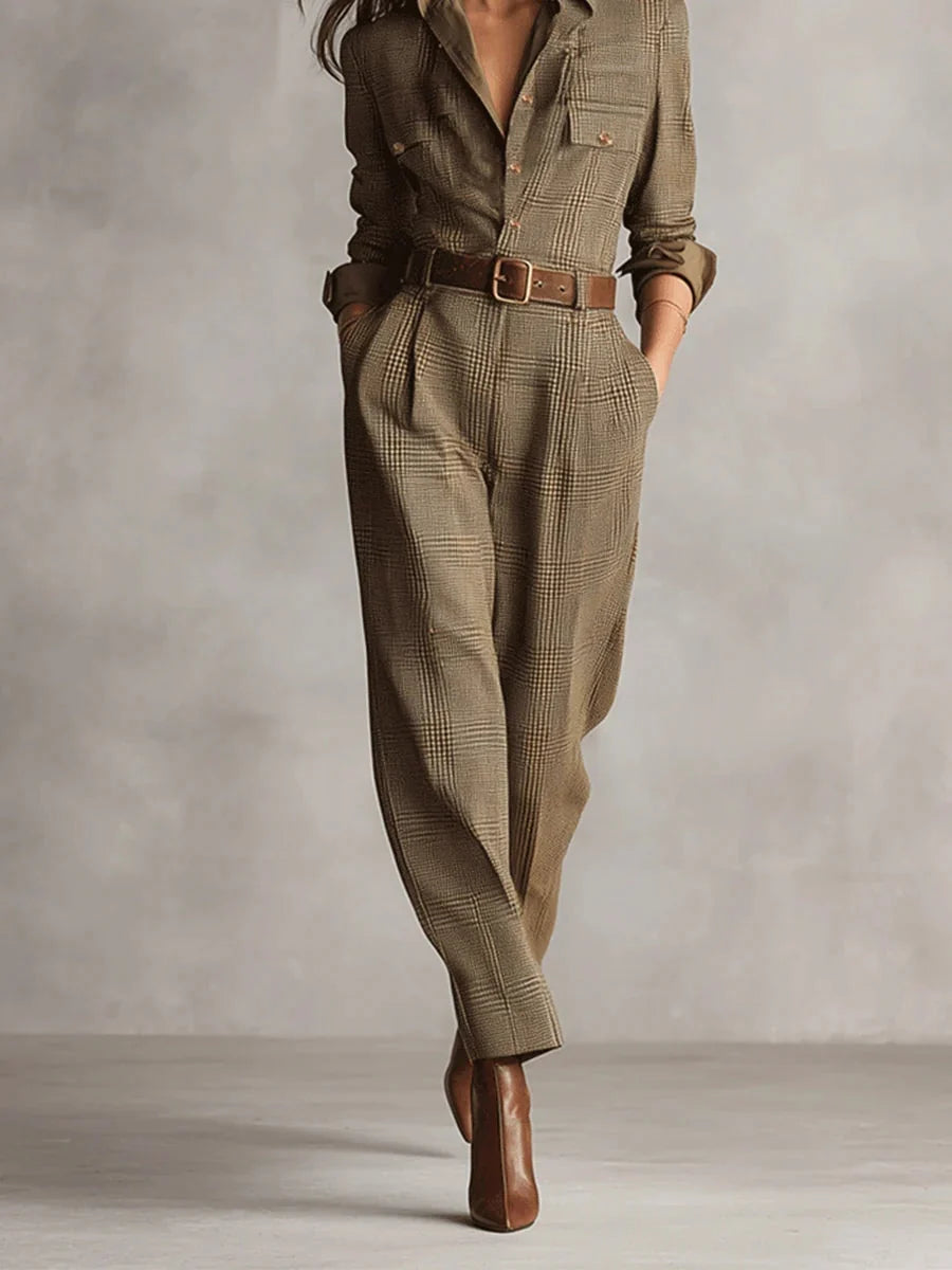 Side view of women's belted checked jumpsuit highlighting relaxed fit and full-length tapered leg