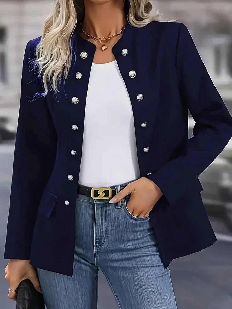 Women's navy double-breasted blazer with silver buttons and open front worn over white tee