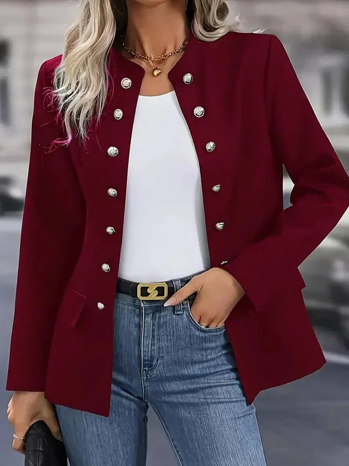 Full-length view of women's navy blazer with fitted silhouette and medium-weight fabric