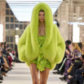 Women's hooded faux fur coat in chartreuse with oversized draped silhouette and open-front design