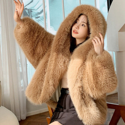 Hooded faux fur coat with voluminous hood and long sleeves shown from the front