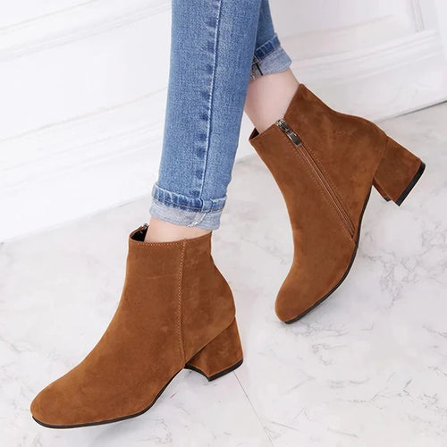 Women's suede ankle boots in tan with block heel and side zip, styled with rolled-up jeans