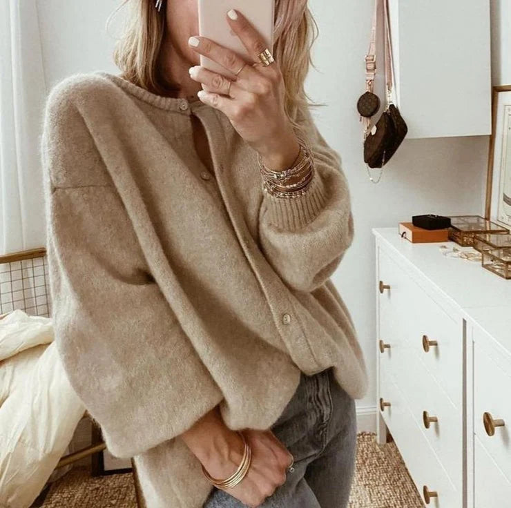 Close-up of fluffy brushed knit texture on women's oversized cardigan with relaxed drape