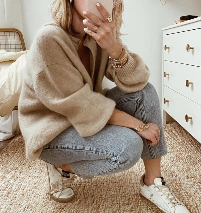 Women's hip-length knit cardigan with button closure and soft brushed finish in neutral taupe