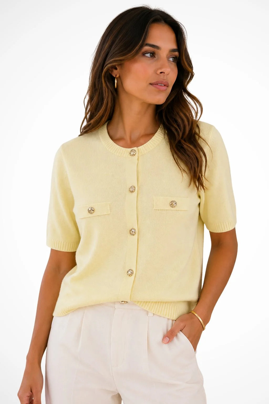 Side view of pink knit cardigan with short sleeves and relaxed fit on model