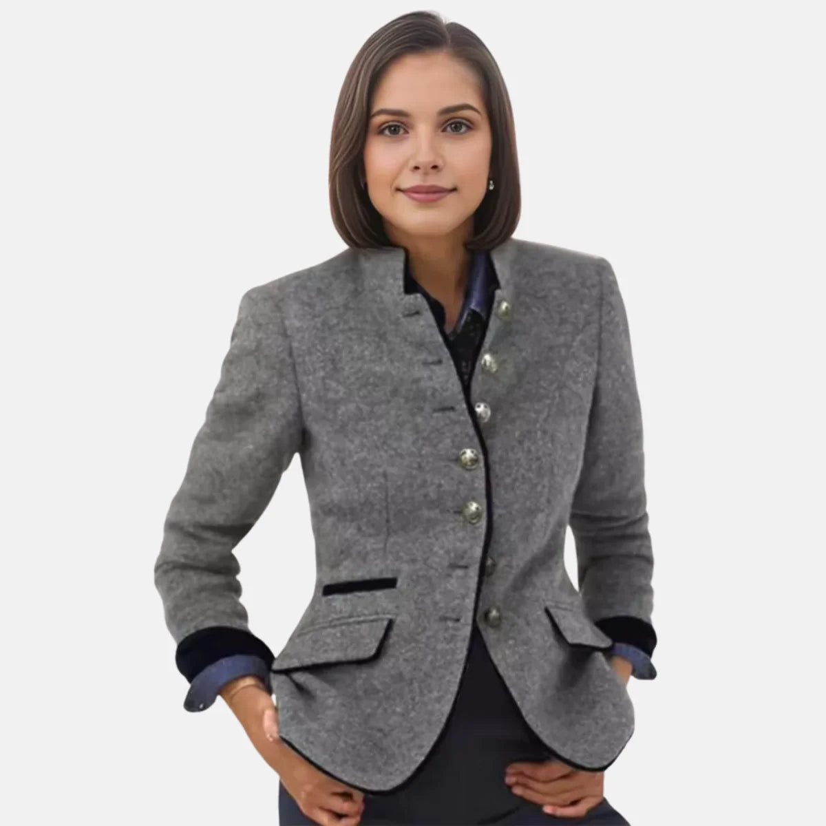 Close-up view of women's structured blazer showing button-front closure and fitted waist detail