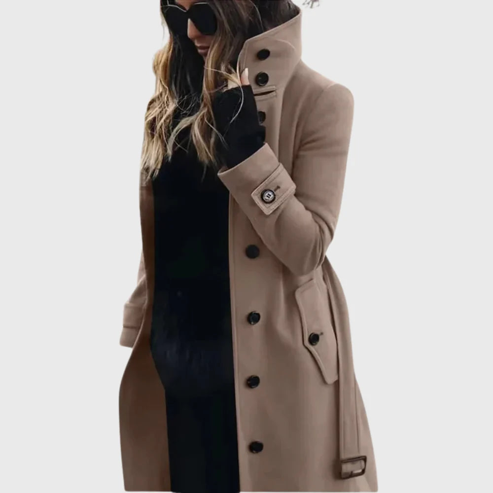 Women's trench coat with high stand collar and button front closure in beige worn with sunglasses