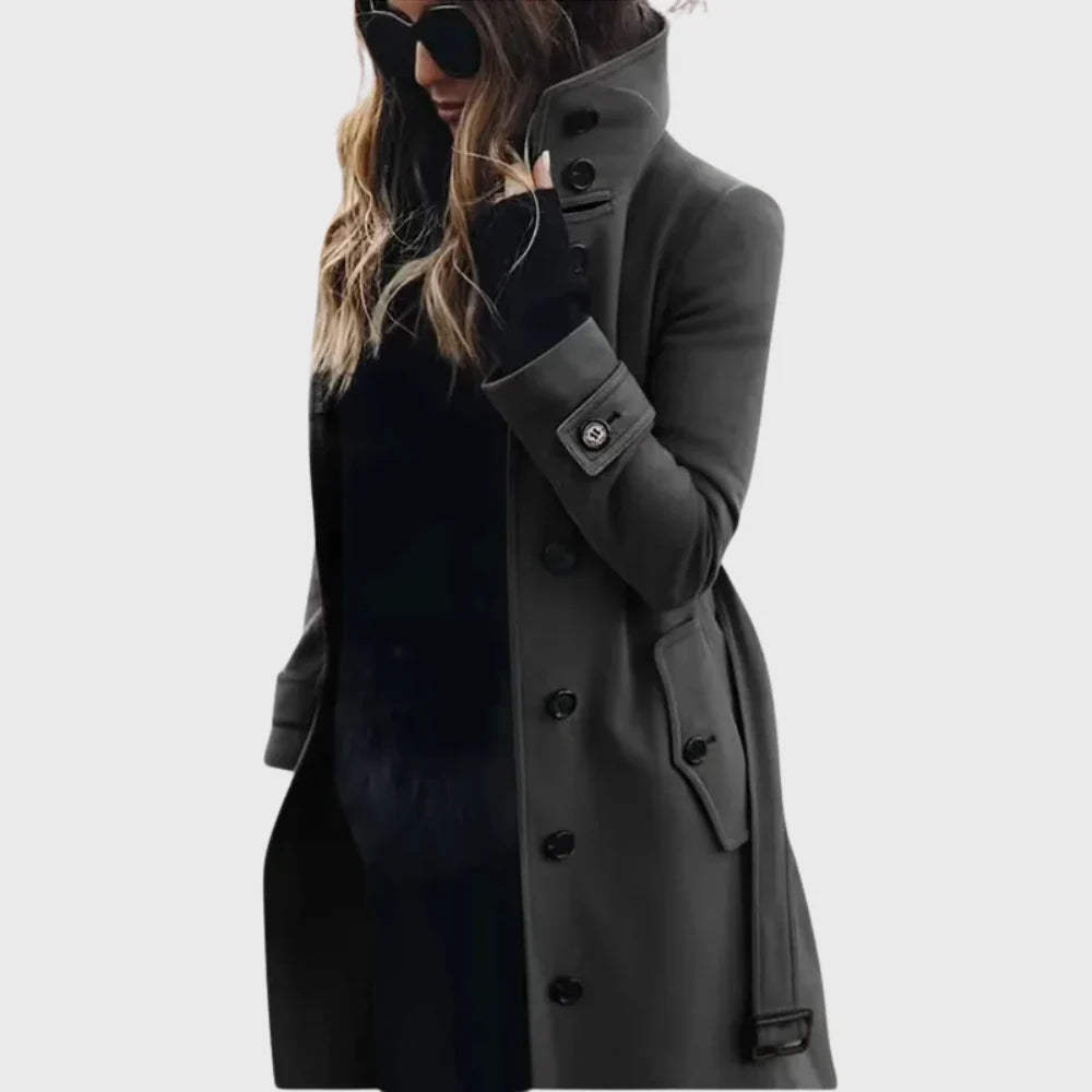 Side view of women's longline trench coat showing straight silhouette and cuff strap detail