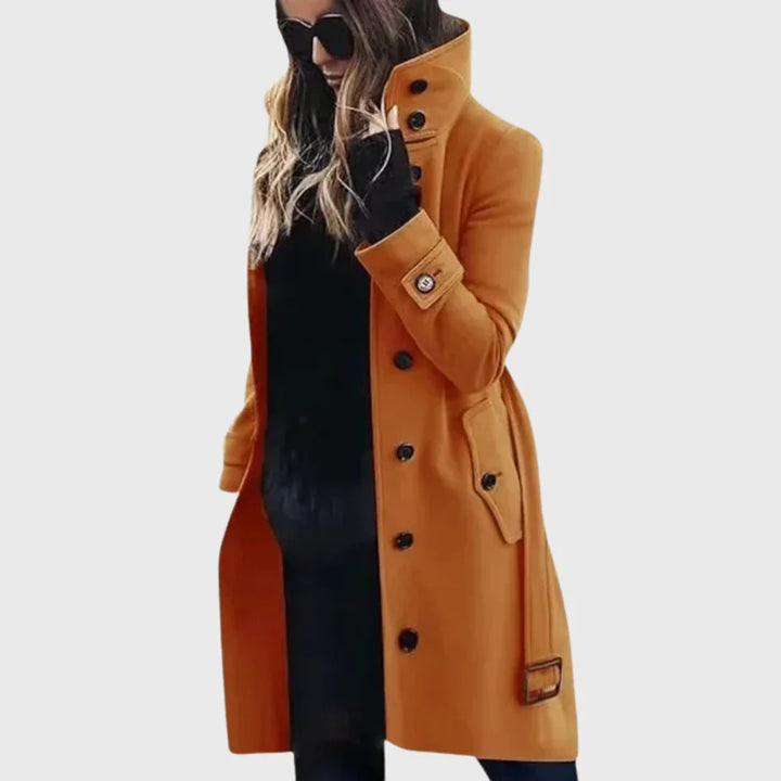 Women's longline trench coat showing tailored fit and smooth fabric surface
