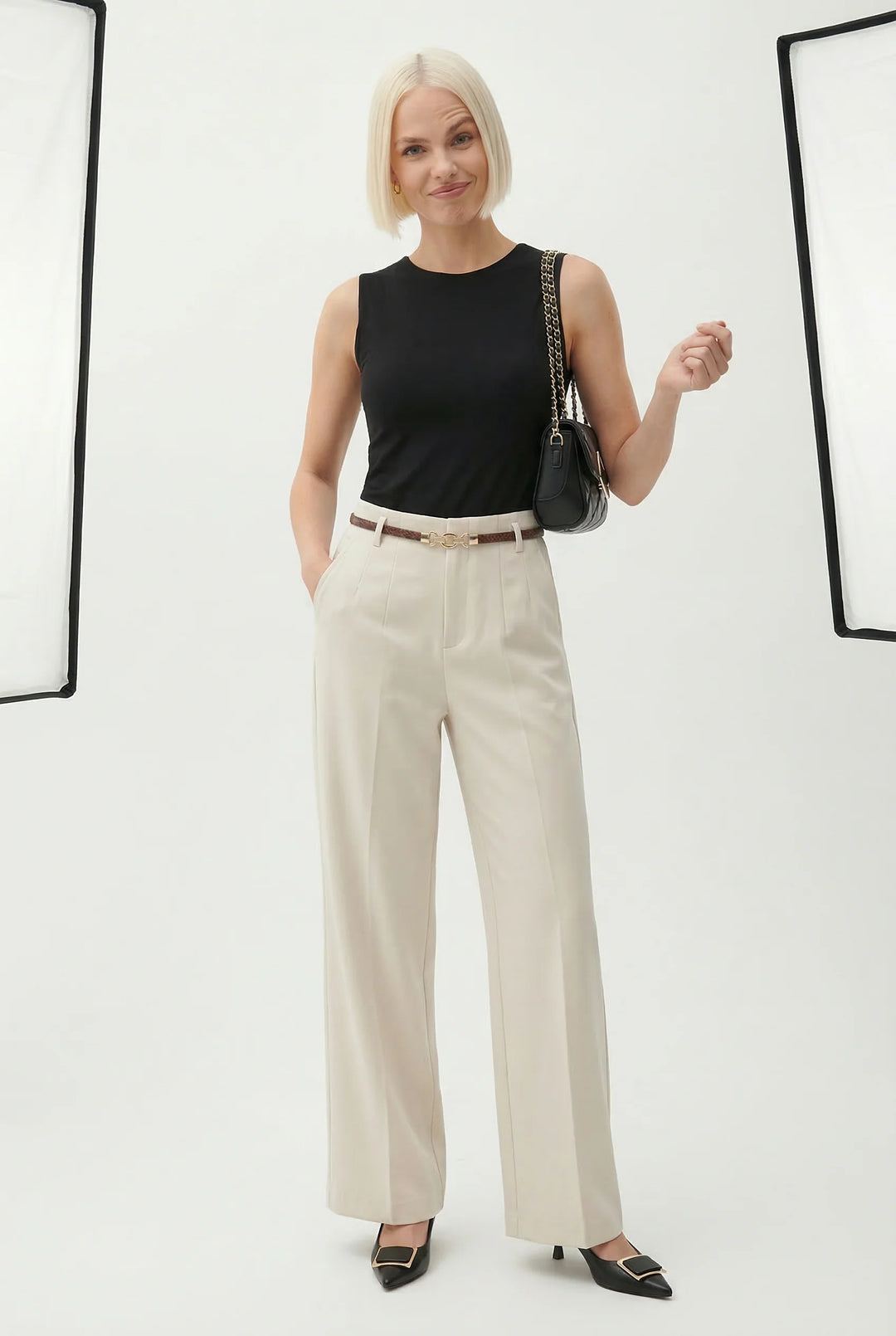 Women's high waist wool trousers with wide leg silhouette in neutral beige tone
