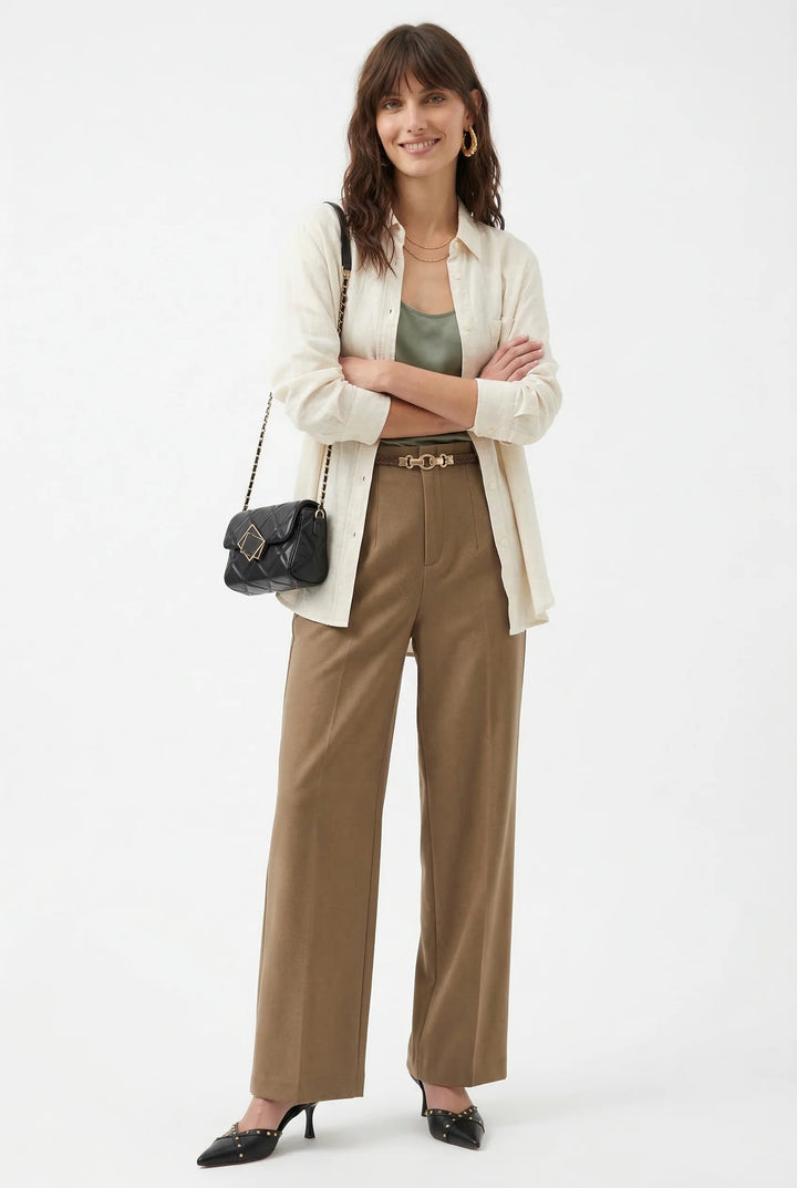 Detail of wool trousers front pleats and tailored waistband with belt