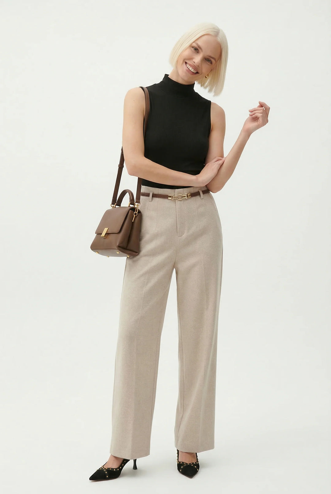Close-up of wool trousers belt loops and included matching slim belt detail