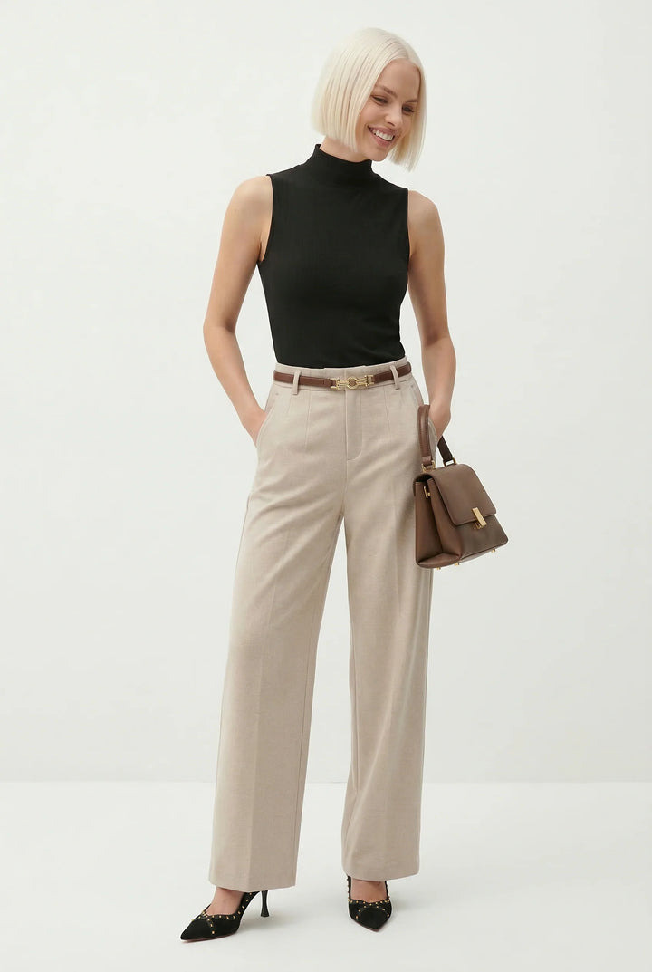Full view of high waist wool trousers with wide leg cut and pressed front creases