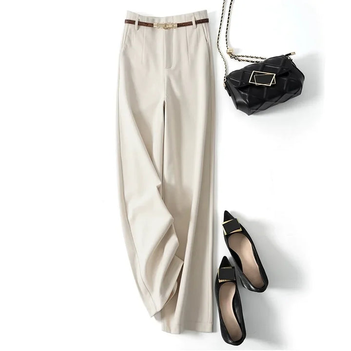 Close-up of tailored wool trousers waistband and belt loop construction