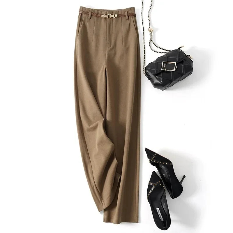 Women wearing high waist wool trousers with crisp tailoring and polished finish