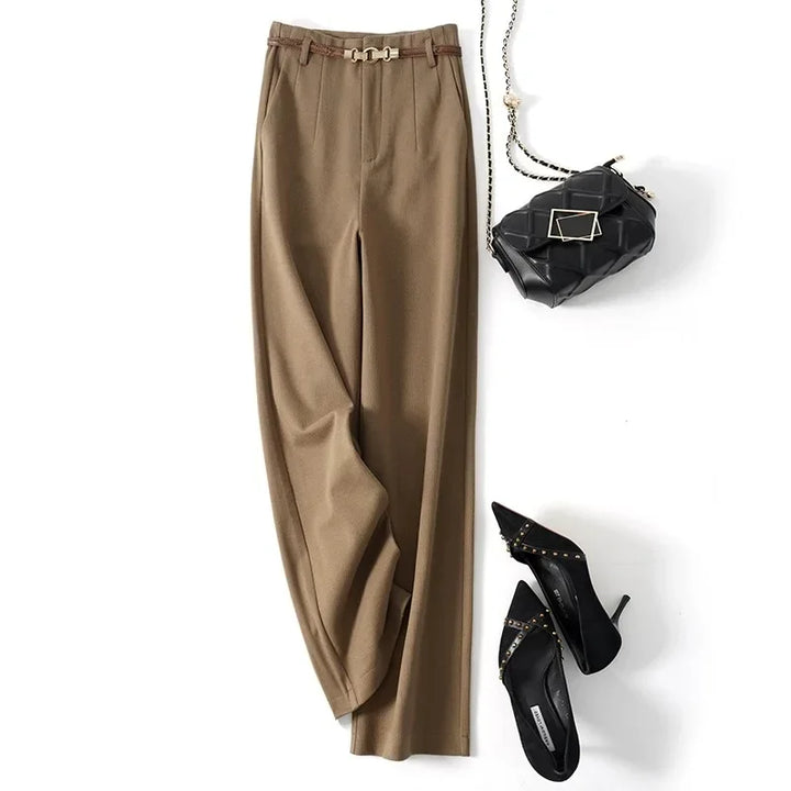 Women wearing high waist wool trousers with crisp tailoring and polished finish
