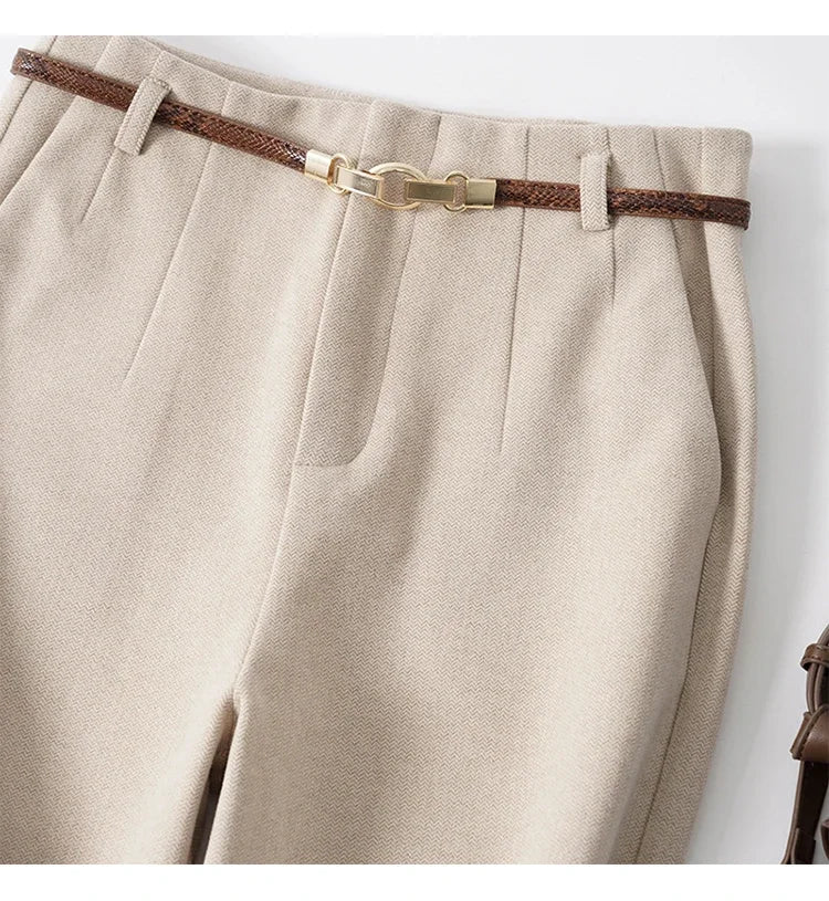 Side profile of tailored wool trousers showing structured drape and clean lines